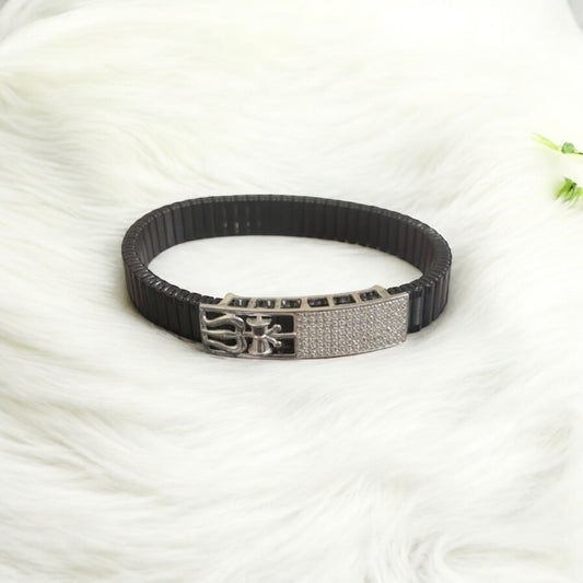 Black and silver bracelet on a white fabric background