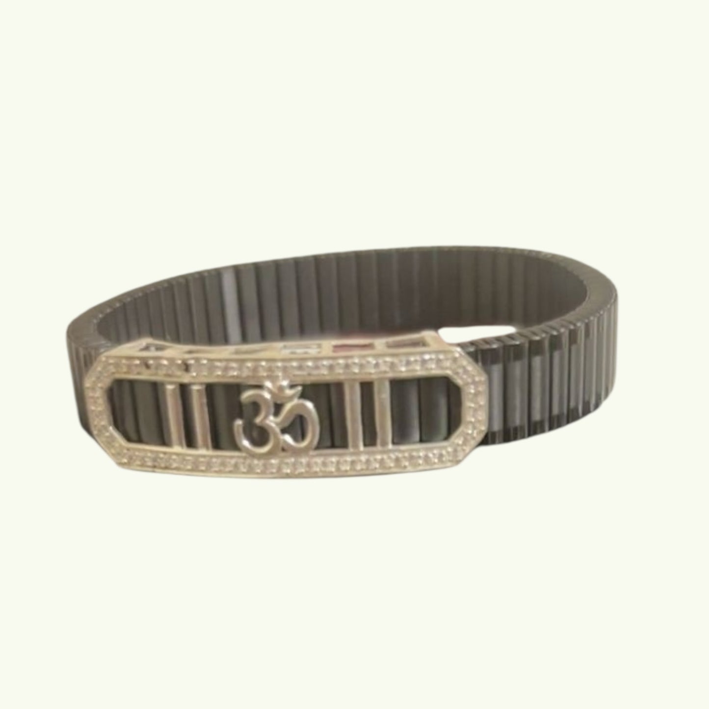 Black belt with gold Om symbol buckle on a white background