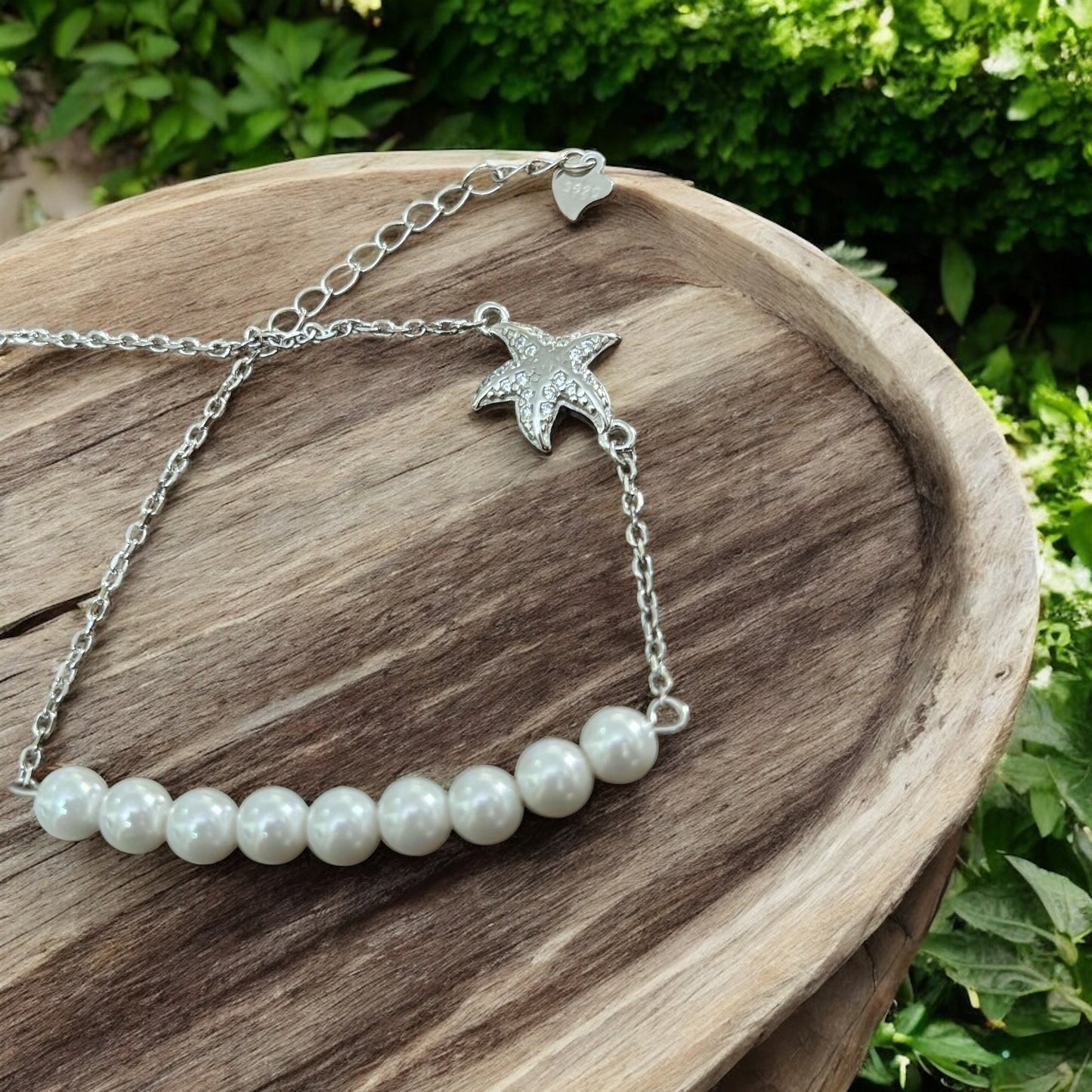 Pearl bracelet with silver star-fish charm