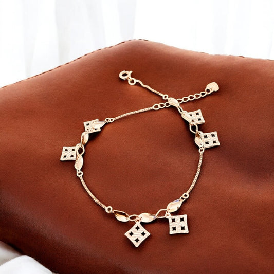 Rose gold bracelet with twisted charms