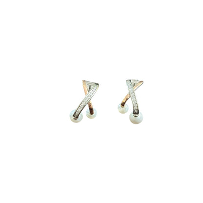 Pair of earrings with X-shaped design on a white background