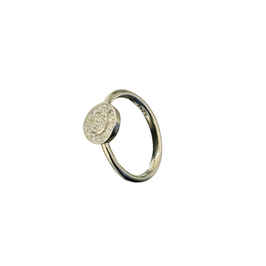 Gold ring with a diamond on a white background