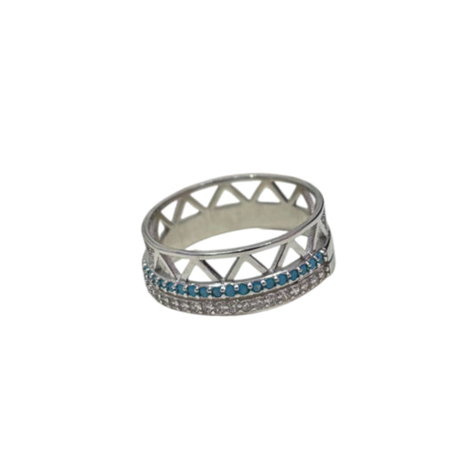 Silver ring with blue gemstones on a white background