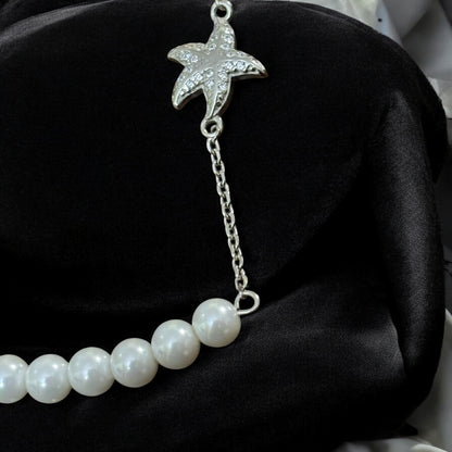 Pearl bracelet with silver star-fish charm