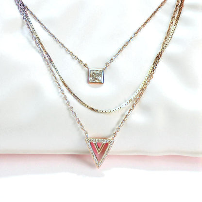 Two necklaces with different pendants on a white background